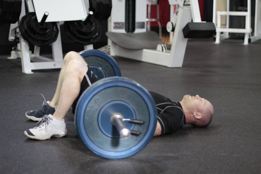 Barbell Glute Bridge, position 1 of 2