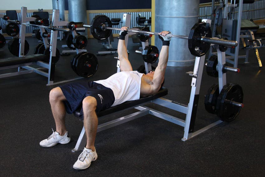 Barbell Guillotine Bench Press, position 1 of 2