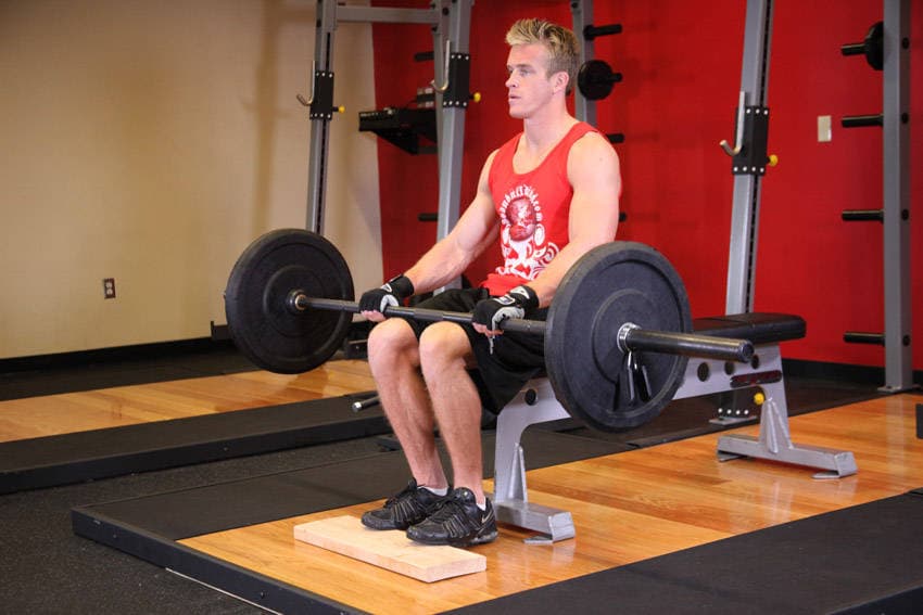 Barbell Seated Calf Raise, position 1 of 2