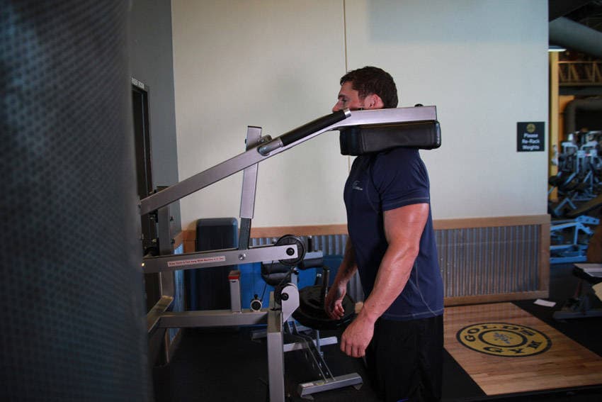 Calf-Machine Shoulder Shrug, position 1 of 2