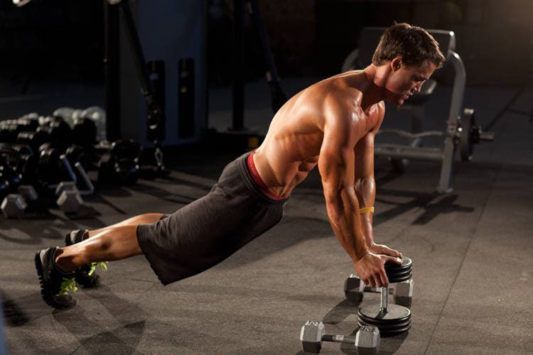 Close-Grip Push-Up off of a Dumbbell, position 1 of 2