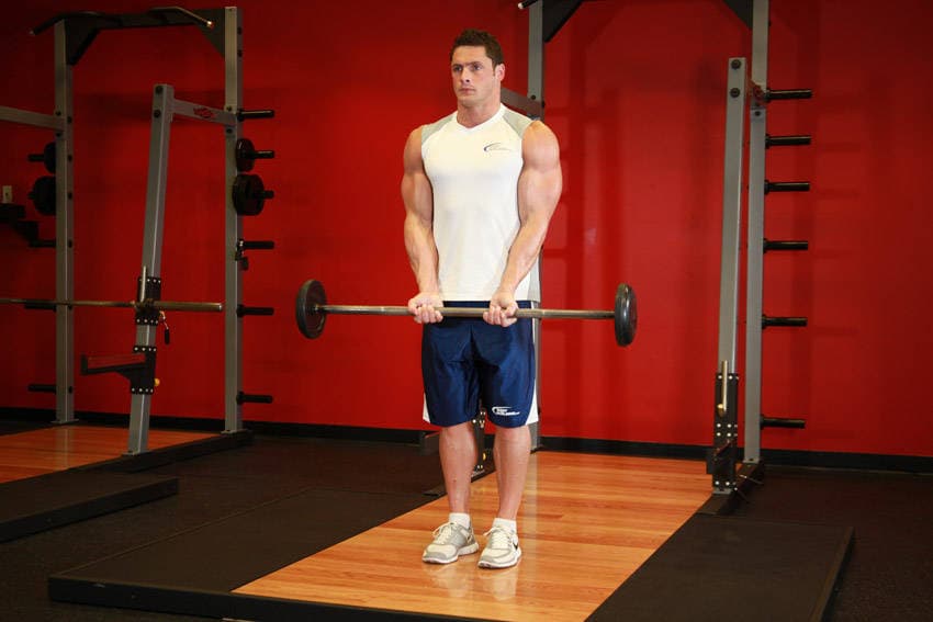 Close-Grip Standing Barbell Curl, position 1 of 2