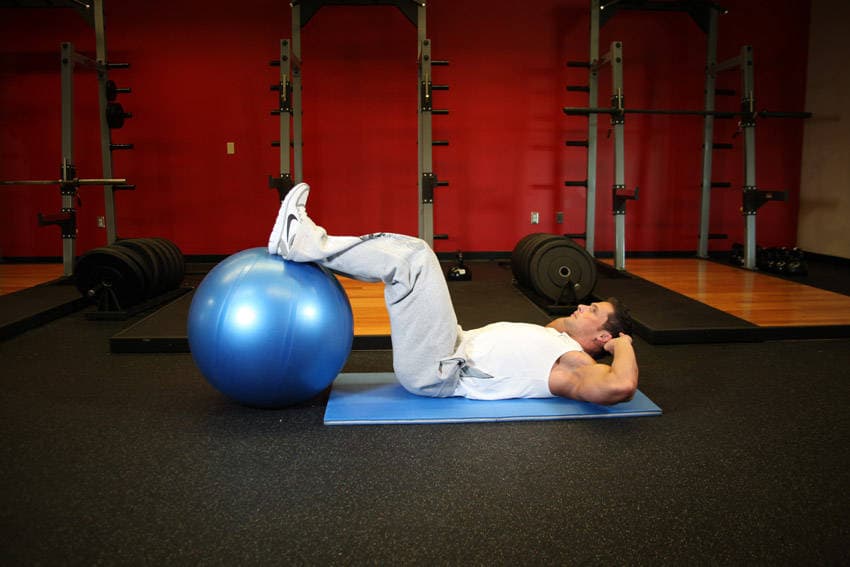 Crunch - Legs On Exercise Ball, position 1 of 2