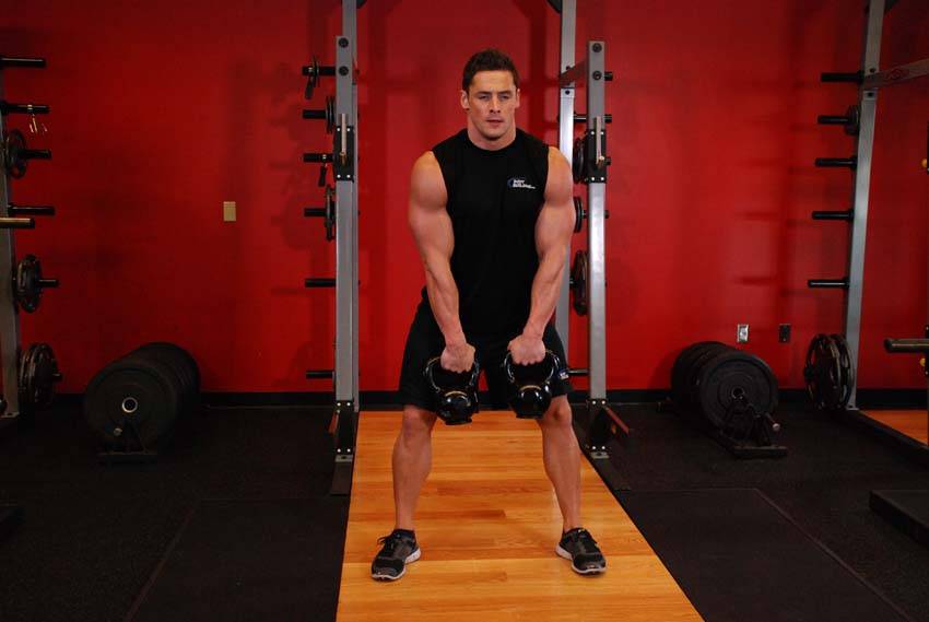 Double Kettlebell Alternating Hang Clean, position 1 of 2