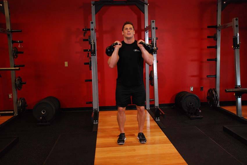Double Kettlebell Jerk, position 2 of 2