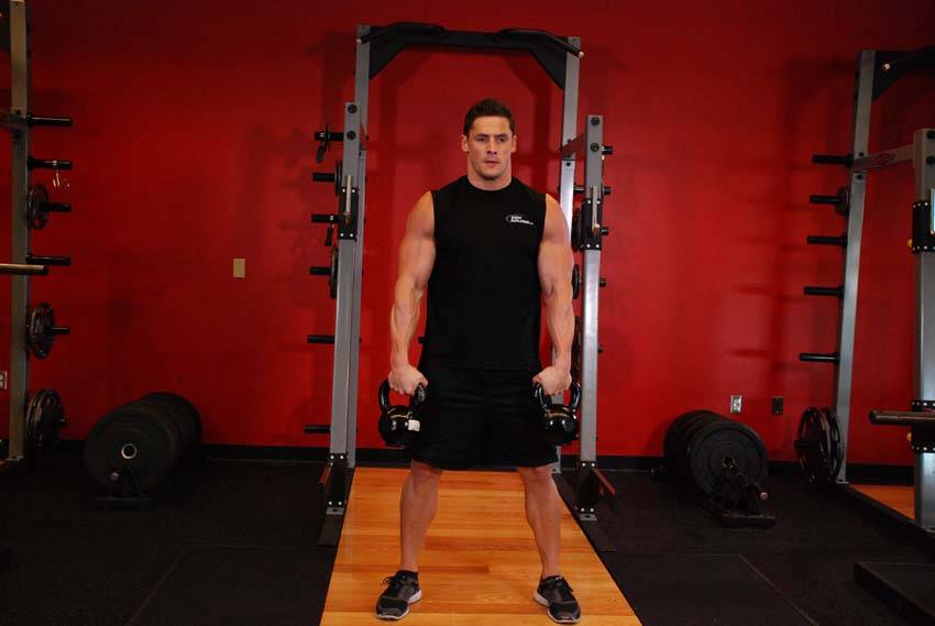 Double Kettlebell Snatch, position 1 of 2