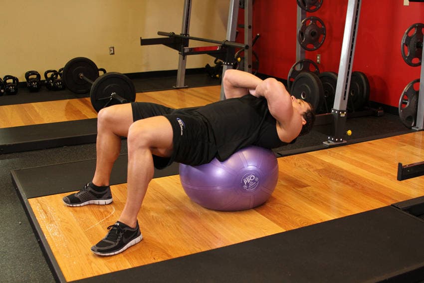 Exercise Ball Crunch, position 1 of 2