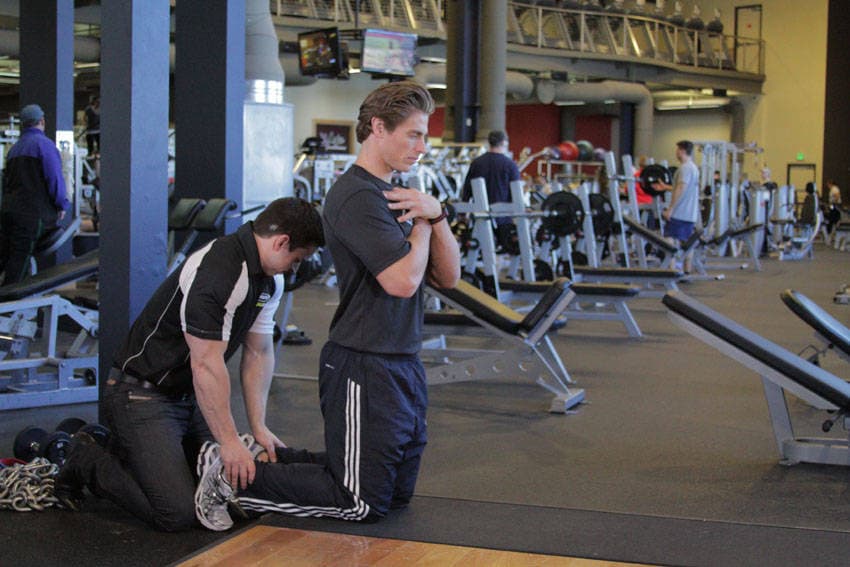 Floor Glute-Ham Raise, position 1 of 2