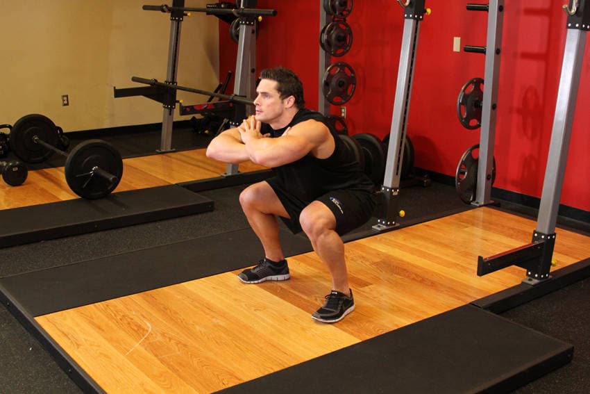 Freehand Jump Squat, position 1 of 2