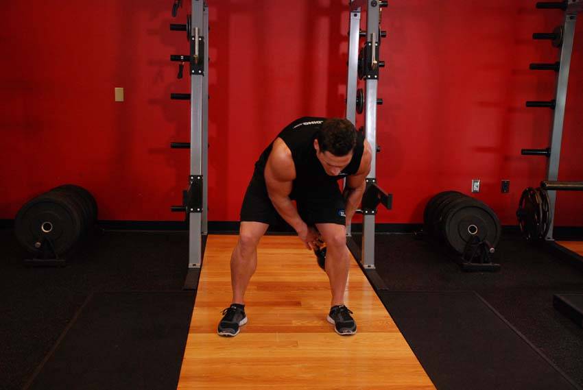 Kettlebell Figure 8, position 1 of 2