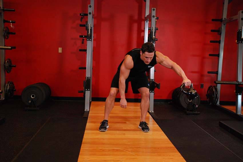 Kettlebell Pass Between The Legs, position 1 of 2