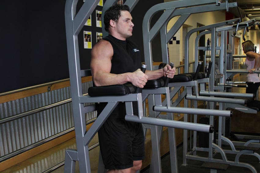 Knee/Hip Raise On Parallel Bars, position 1 of 2