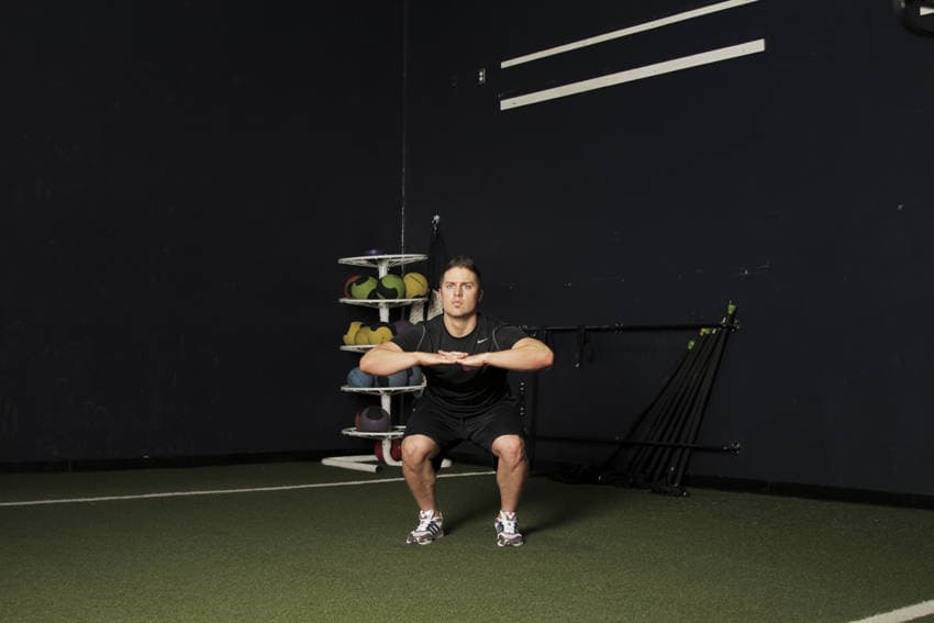 Knee Tuck Jump, position 1 of 2