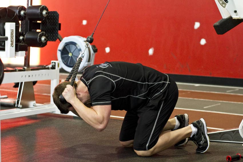 Kneeling Cable Crunch With Alternating Oblique Twists, position 2 of 2