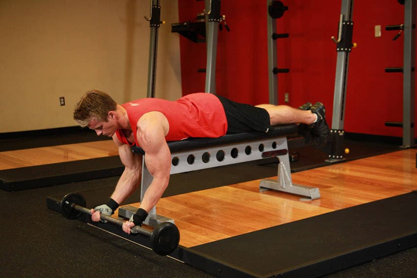 Lying High Bench Barbell Curl, position 1 of 2