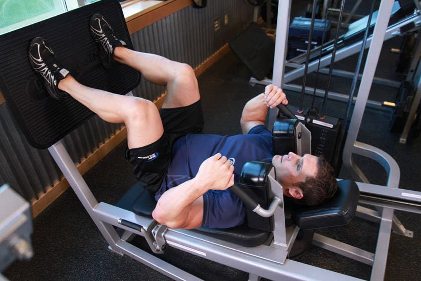 Lying Machine Squat, position 1 of 2