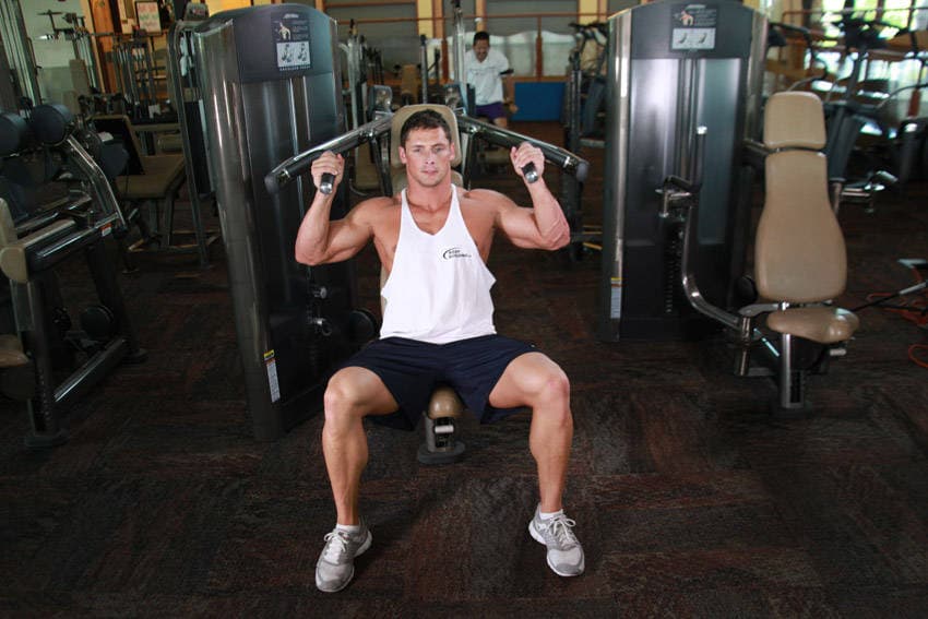 Machine Shoulder (Military) Press, position 1 of 2