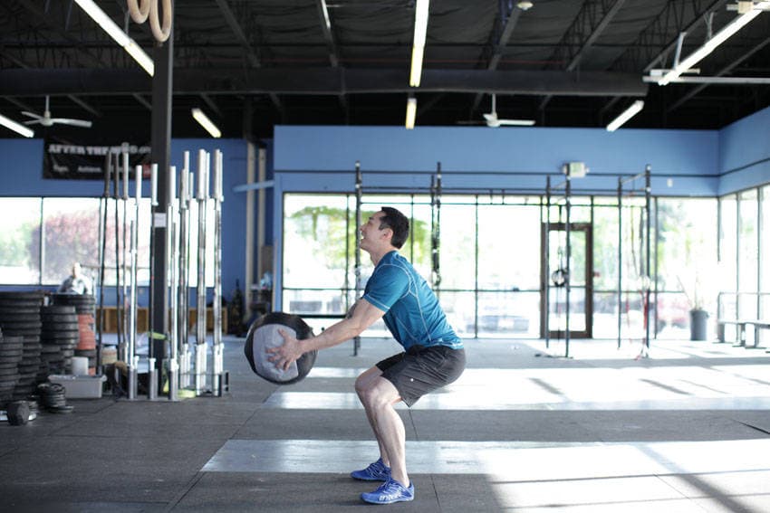 Medicine Ball Scoop Throw, position 1 of 2