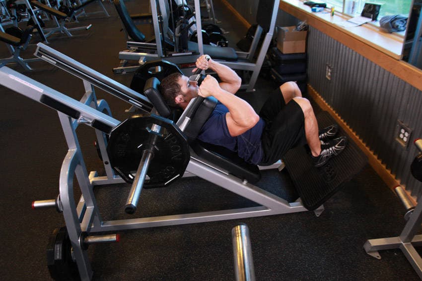 Narrow Stance Hack Squats, position 1 of 2