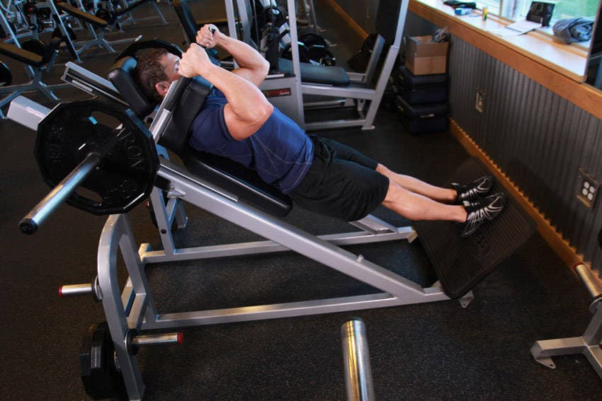 Narrow Stance Hack Squats, position 2 of 2