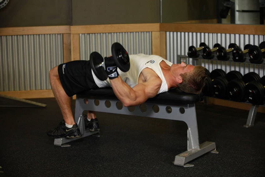 One-Arm Flat Bench Dumbbell Flye, position 1 of 2