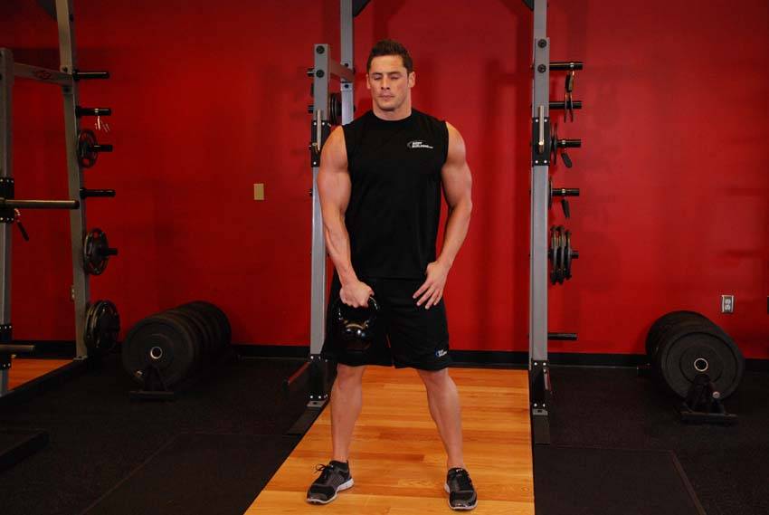 One-Arm Kettlebell Clean, position 1 of 2
