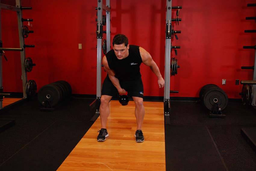 One-Arm Kettlebell Clean, position 2 of 2