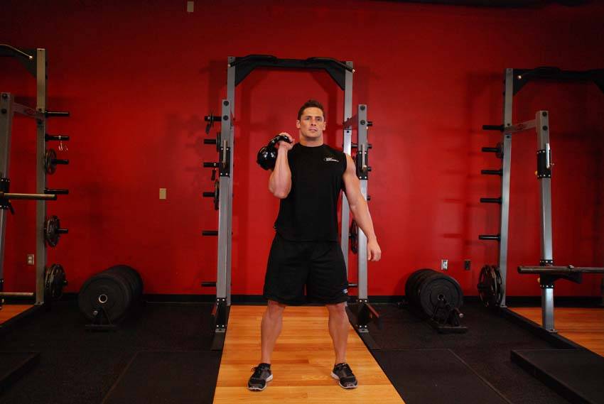 One-Arm Kettlebell Clean and Jerk, position 2 of 2