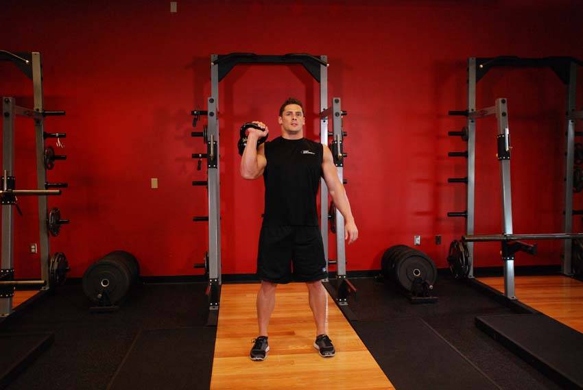 One-Arm Kettlebell Jerk, position 1 of 2