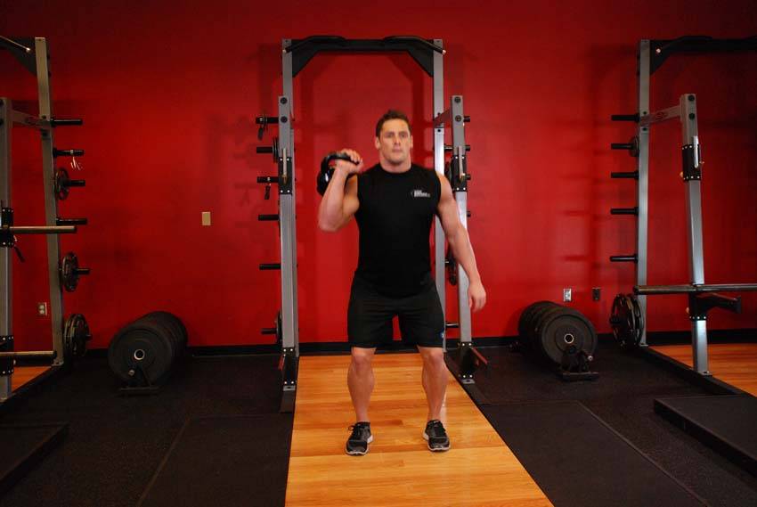One-Arm Kettlebell Split Jerk, position 2 of 2