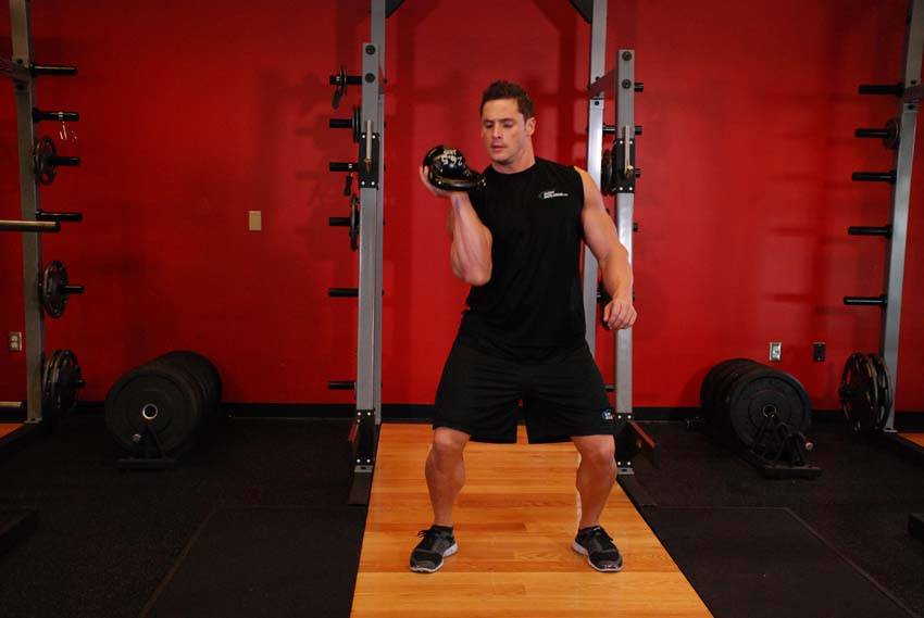 One-Arm Open Palm Kettlebell Clean, position 2 of 2