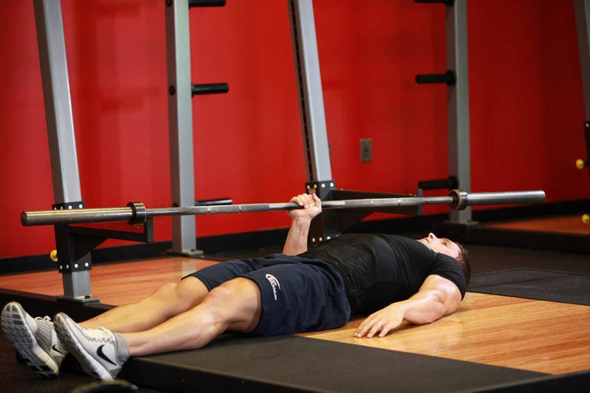 One Arm Floor Press, position 1 of 2