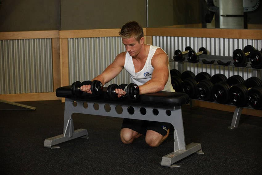 Palms-Down Dumbbell Wrist Curl Over A Bench, position 2 of 2
