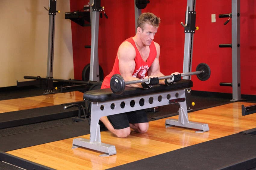 Palms-Up Barbell Wrist Curl Over A Bench, position 2 of 2