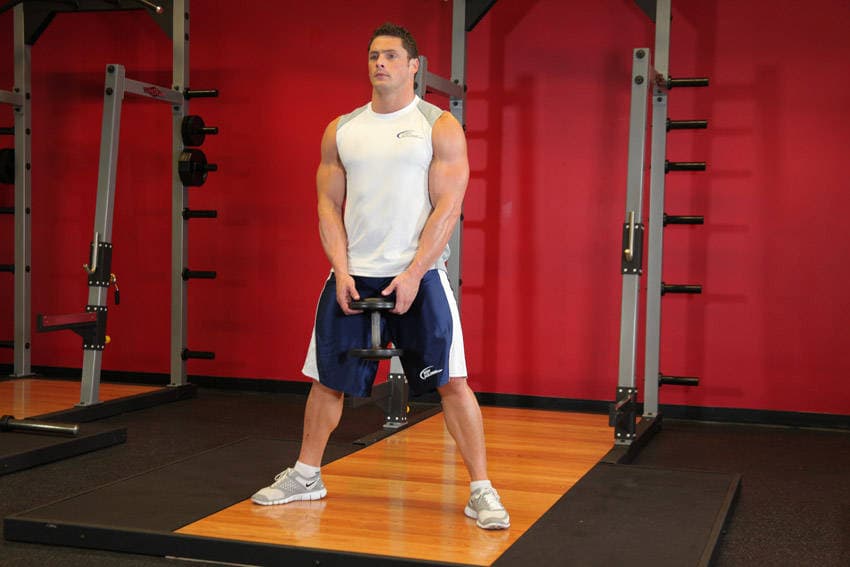 Plie Dumbbell Squat, position 1 of 2