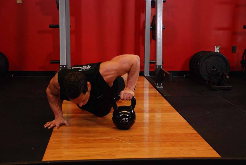 Plyo Kettlebell Pushups, position 1 of 2