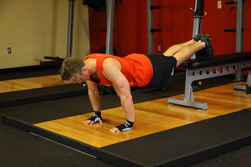 Push-Ups With Feet Elevated, position 1 of 2