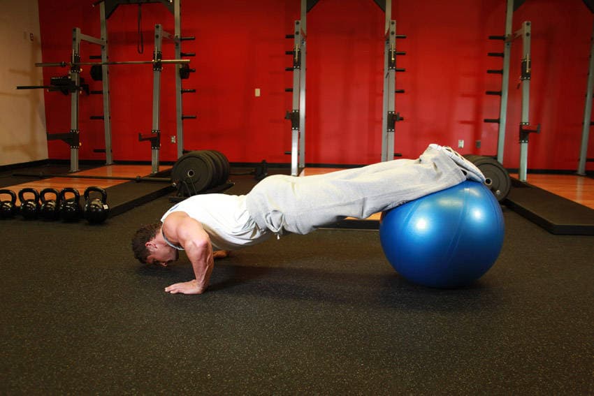 Push-Ups With Feet On An Exercise Ball, position 1 of 2