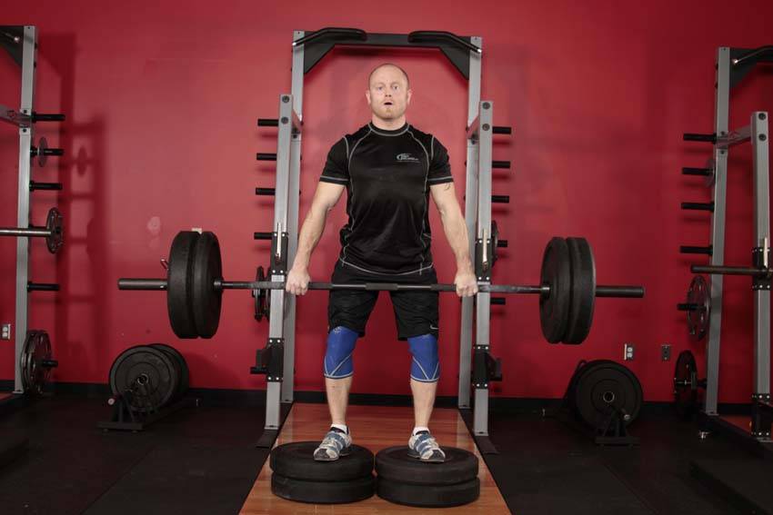 Romanian Deadlift from Deficit, position 1 of 2