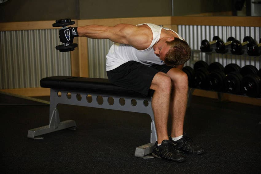 Seated Bent-Over One-Arm Dumbbell Triceps Extension, position 2 of 2