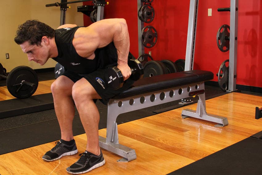 Seated Bent-Over Two-Arm Dumbbell Triceps Extension, position 1 of 2