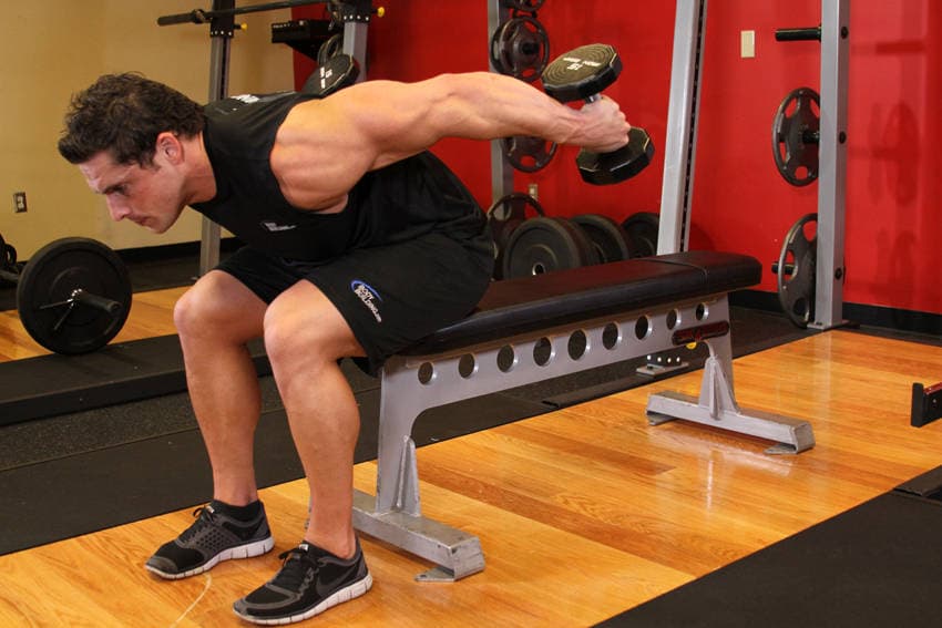 Seated Bent-Over Two-Arm Dumbbell Triceps Extension, position 2 of 2