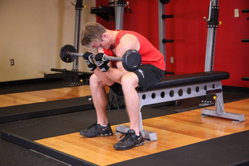 Seated Close-Grip Concentration Barbell Curl, position 2 of 2
