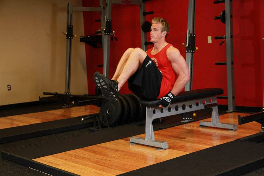 Seated Flat Bench Leg Pull-In, position 2 of 2