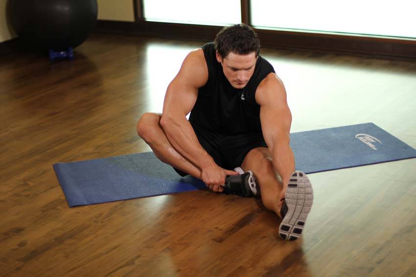 Seated Floor Hamstring Stretch, position 1 of 2