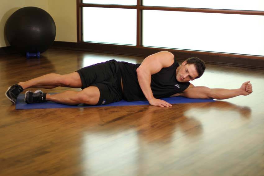 Side-Lying Floor Stretch, position 1 of 2