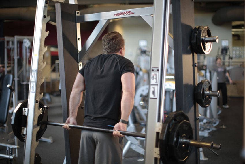 Smith Machine Behind the Back Shrug, position 2 of 2