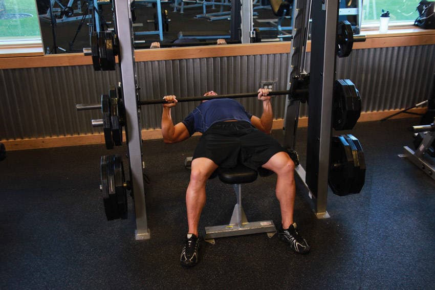 Smith Machine Bench Press, position 1 of 2