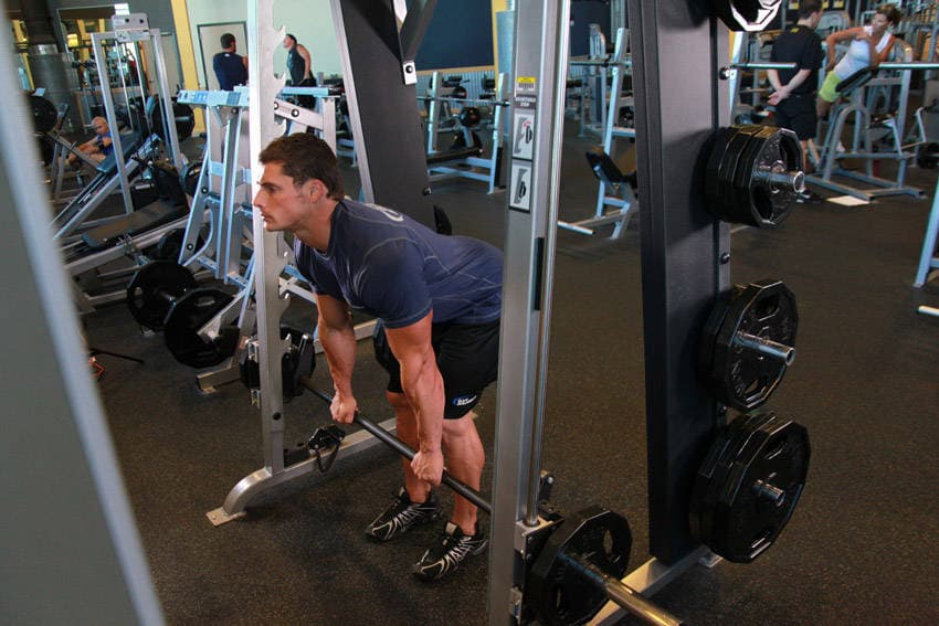 Smith Machine Stiff-Legged Deadlift, position 1 of 2