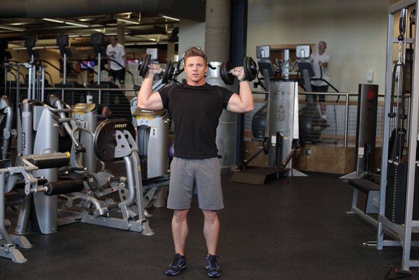 Standing Alternating Dumbbell Press, position 1 of 2